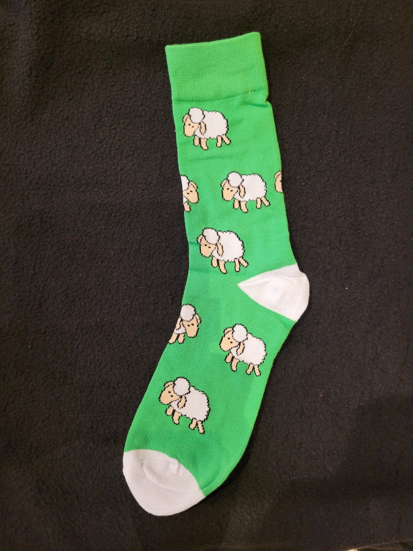 Sheep on a green sock